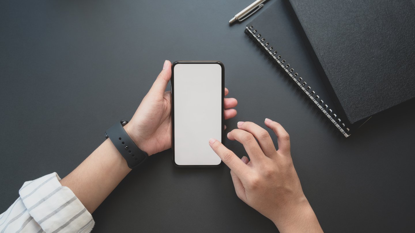 Person Holding White Iphone 5 C